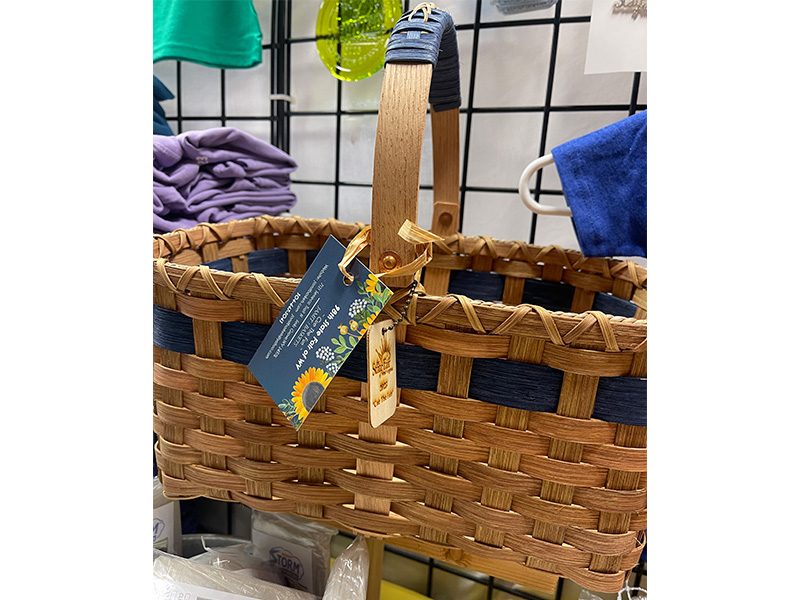 Photo of woven basket with blue ribbon and tag